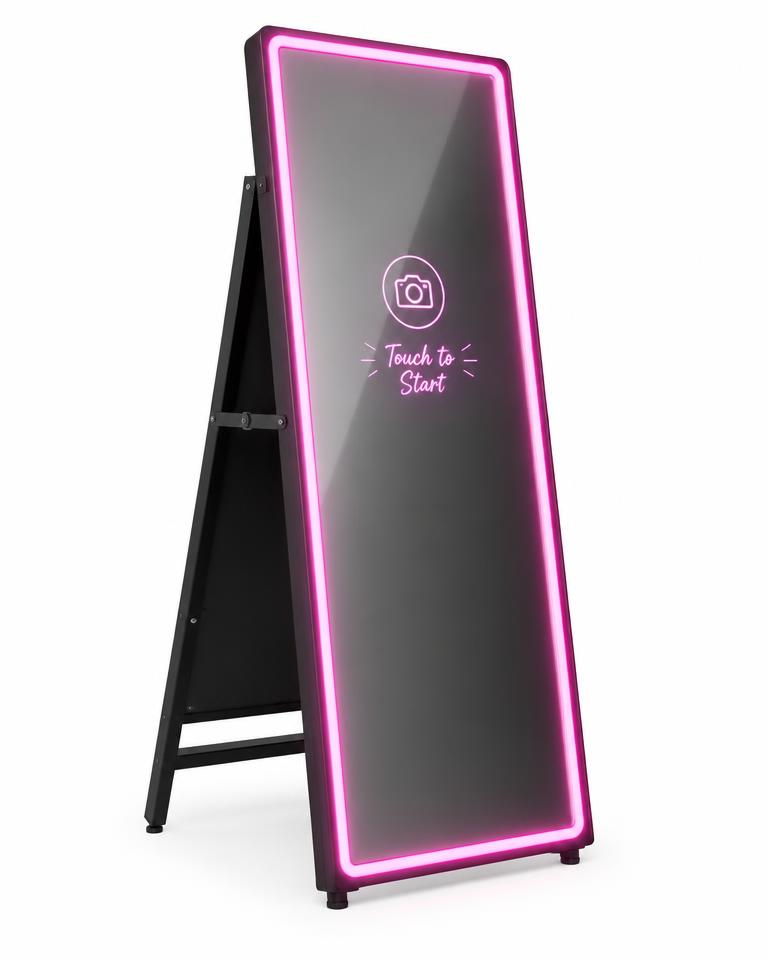 Slim mirror booth with glowing pink border on a folding A-frame stand